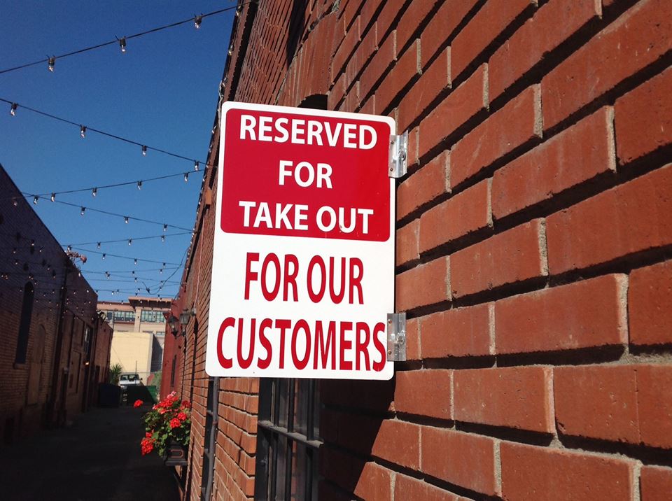 A sign that says reserved for take out for our customers