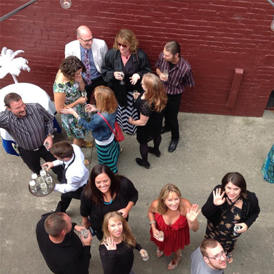 2-PE people outside waving and looking up at a private event